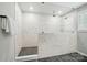 Bathroom features a glass enclosed shower with marble tile, rain shower head and built-in shower niche at 9843 Quercus Ln, Huntersville, NC 28078