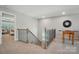 Spacious landing area with a railing, view of downstairs, and game table at 9843 Quercus Ln, Huntersville, NC 28078