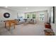 Inviting living room with a sectional sofa, game table, and plenty of natural light at 9843 Quercus Ln, Huntersville, NC 28078
