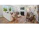 A bright living room featuring a fireplace, large windows, and stylish furnishings, creating a comfortable and inviting atmosphere at 9843 Quercus Ln, Huntersville, NC 28078