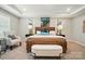 Serene main bedroom featuring neutral tones, tray ceiling, and decorative accents at 9843 Quercus Ln, Huntersville, NC 28078
