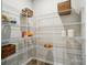 A spacious pantry with wire shelving offers ample storage, enhancing the organization and functionality of the home at 9843 Quercus Ln, Huntersville, NC 28078
