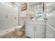 Modern bathroom featuring a glass-enclosed shower and vanity with clean lines and neutral color scheme at 9930 Cask Way, Huntersville, NC 28078