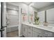 Bright bathroom with double vanity, shower and tub combination, and modern fixtures at 9930 Cask Way, Huntersville, NC 28078