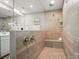 Modern bathroom features a large glass shower with a built-in bench and premium fixtures at 9930 Cask Way, Huntersville, NC 28078