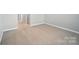 Neutral carpet and white trim and baseboards shown in this bedroom at 9930 Cask Way, Huntersville, NC 28078