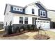 Beautiful two-story home featuring gray siding, white accents, and a two-car garage at 9930 Cask Way, Huntersville, NC 28078