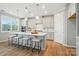 The kitchen island with seating area and updated kitchen design at 9930 Cask Way, Huntersville, NC 28078