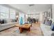 Open-concept living space with neutral decor, connecting to the dining and kitchen areas at 9930 Cask Way, Huntersville, NC 28078