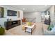 Spacious living area with modern furniture, a media center, and easy access to the stairway at 9930 Cask Way, Huntersville, NC 28078