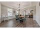 Inviting dining room showcasing a wooden table, decorative lighting, and easy access to other living spaces at 1048 Harbor Bay Dr, Indian Land, SC 29707