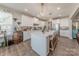 Bright kitchen with white cabinets, stainless steel appliances, and an island for extra seating and counter space at 1048 Harbor Bay Dr, Indian Land, SC 29707