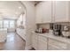 Open kitchen and butler's pantry featuring white cabinetry, countertops, and stainless appliances at 1048 Harbor Bay Dr, Indian Land, SC 29707