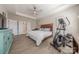 Comfortable main bedroom featuring a tray ceiling and hardwood floors at 1048 Harbor Bay Dr, Indian Land, SC 29707