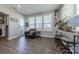 Cozy sitting area with natural light, a leather chair, and a desk by the windows at 1048 Harbor Bay Dr, Indian Land, SC 29707