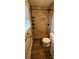 Bathroom complete with tiled shower and floors, glass door and corner shelves, and a modern toilet at 1060 Laurel Ln, Gastonia, NC 28054