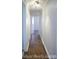 Hallway with hardwood floors, neutral paint and trim, and recessed ceiling lights at 1060 Laurel Ln, Gastonia, NC 28054