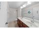 Bright bathroom featuring double sinks, a tub-shower combo, and cheerful nautical decor at 1100 Wallace Lake Rd, Fort Mill, SC 29707