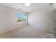 Cozy bedroom with a large window and plush carpet flooring at 1100 Wallace Lake Rd, Fort Mill, SC 29707