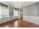 Inviting dining room with hardwood floors, decorative molding, and neutral walls, ideal for entertaining at 1100 Wallace Lake Rd, Fort Mill, SC 29707