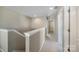 Upstairs hallway featuring carpeted floors, neutral walls, and linen closet at 1100 Wallace Lake Rd, Fort Mill, SC 29707