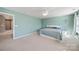 Large main bedroom with a ceiling fan, two windows, and tranquil light blue walls at 1100 Wallace Lake Rd, Fort Mill, SC 29707