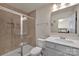 Bathroom featuring a glass shower, a tiled wall, and a gray vanity at 11017 Woodland Creek Way, Charlotte, NC 28262