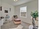 Bedroom with a daybed, plants, sunlight, and carpeted floors at 11017 Woodland Creek Way, Charlotte, NC 28262