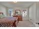 Bright bedroom with a large dresser, modern decorations, and neutral carpet at 11017 Woodland Creek Way, Charlotte, NC 28262