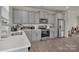 Modern kitchen with stainless steel appliances and stylish gray cabinets at 11017 Woodland Creek Way, Charlotte, NC 28262