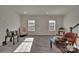 Open living room with gray flooring, recessed lighting, and modern decor at 11017 Woodland Creek Way, Charlotte, NC 28262