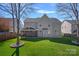 Backyard showing the lawn, patio, screened porch and exterior of the home at 114 Runningdeer Dr, Mooresville, NC 28117