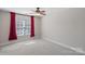 Bedroom with carpeted floor, ceiling fan and natural light at 114 Runningdeer Dr, Mooresville, NC 28117