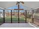 Relaxing screened-in porch with views of the backyard and vaulted ceiling at 114 Runningdeer Dr, Mooresville, NC 28117