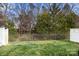 Well-maintained backyard with lush lawn and privacy fence at 12031 Windy Rock Way # 1002, Charlotte, NC 28273