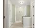 Upstairs hallway with neutral paint and carpet, along with access to multiple rooms at 12031 Windy Rock Way # 1002, Charlotte, NC 28273