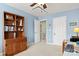 Comfortable home office with shelving, desk and multiple access doors at 12031 Windy Rock Way # 1002, Charlotte, NC 28273