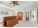 Open main bedroom with neutral walls and carpet, matched with light wooden furniture at 12031 Windy Rock Way # 1002, Charlotte, NC 28273