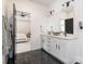 Modern bathroom featuring a double vanity, sleek black fixtures, and a stylish design at 12234 Rowan Hill Dr, Huntersville, NC 28078