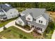 An aerial view of a home showing the roof, lawn and landscaping on a sunny day at 13108 Brooklyn Skylar Way, Huntersville, NC 28078