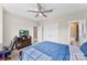 Relaxing bedroom with a comfortable bed, ceiling fan, and views to the bathroom and hall at 13108 Brooklyn Skylar Way, Huntersville, NC 28078