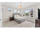 Bright bedroom with large windows offering natural light, complemented by a comfortable queen-size bed at 13108 Brooklyn Skylar Way, Huntersville, NC 28078