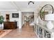 Inviting entryway with hardwood floors, elegant console table, and stylish decor at 13108 Brooklyn Skylar Way, Huntersville, NC 28078