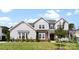 Beautiful two-story home featuring a manicured lawn and a charming front entrance at 13108 Brooklyn Skylar Way, Huntersville, NC 28078