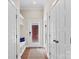 Hallway featuring a front door, built in shelves and seating, and entry into another room at 13108 Brooklyn Skylar Way, Huntersville, NC 28078