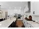 Modern kitchen featuring white cabinets, stainless steel appliances, and a central island for cooking at 13108 Brooklyn Skylar Way, Huntersville, NC 28078