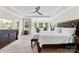 Spacious main bedroom with a decorative tray ceiling and large windows showcasing outdoor views at 13108 Brooklyn Skylar Way, Huntersville, NC 28078