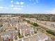 Aerial view of neighborhood featuring townhomes and commercial properties in the background at 14139 Winford Ln, Charlotte, NC 28262