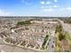 Aerial shot of neighborhood featuring townhomes and mature trees at 14139 Winford Ln, Charlotte, NC 28262