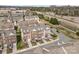 Aerial shot of townhomes with garages and street parking with greenery in the background at 14139 Winford Ln, Charlotte, NC 28262